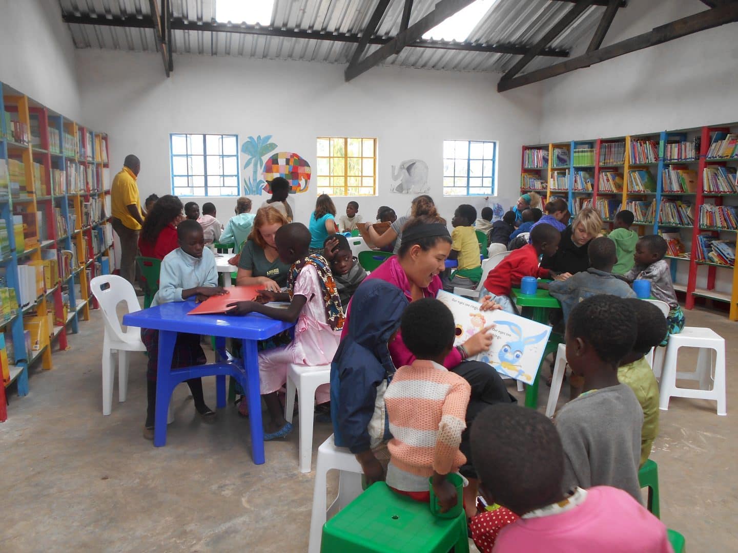 Guests joining a school library project in Malawi with Fisherman's Rest Lodge.